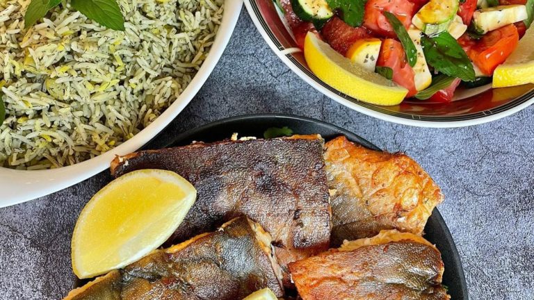 arctic char fried with persian dill rice and lemons